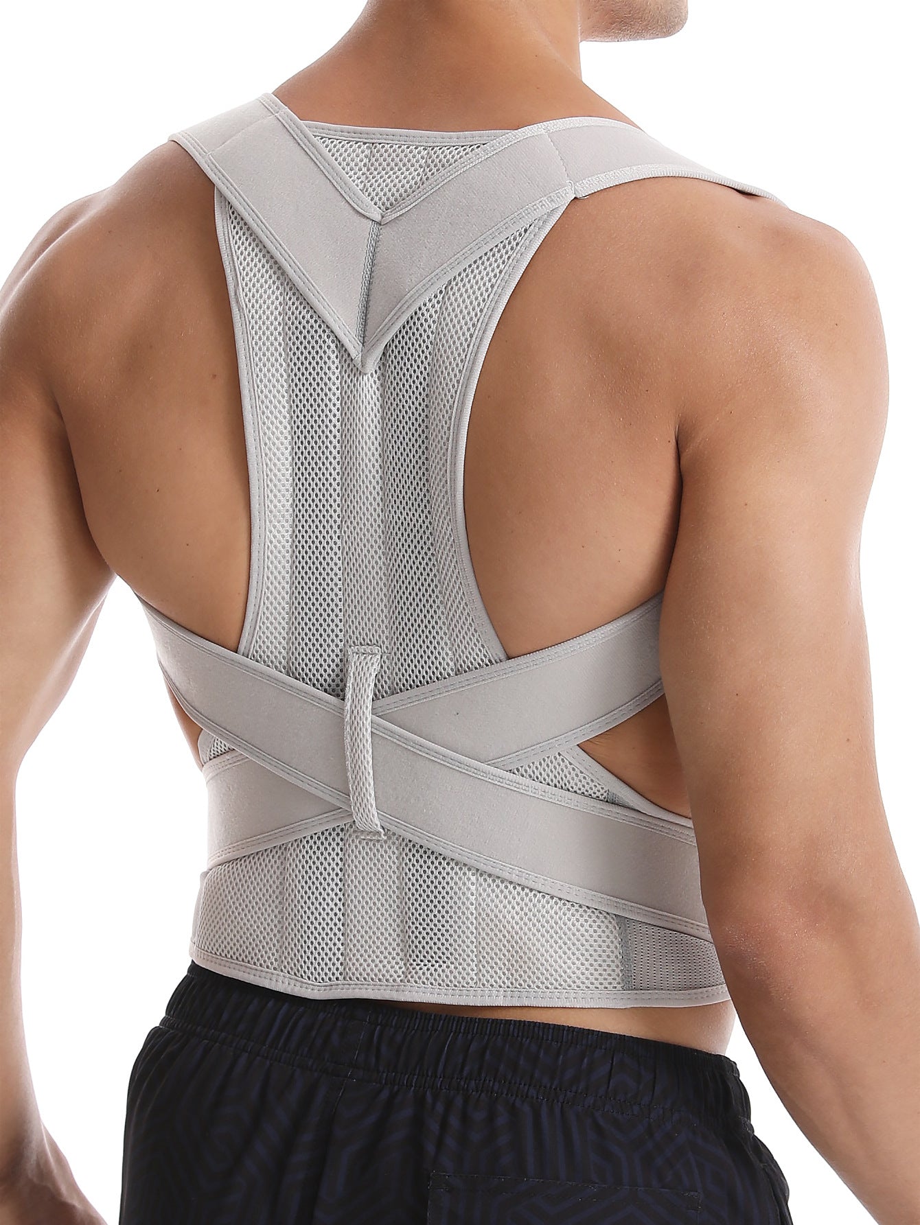 AXEN PostureAlign™ back posture corrector for improved spinal alignment, shown worn over clothing on a person.